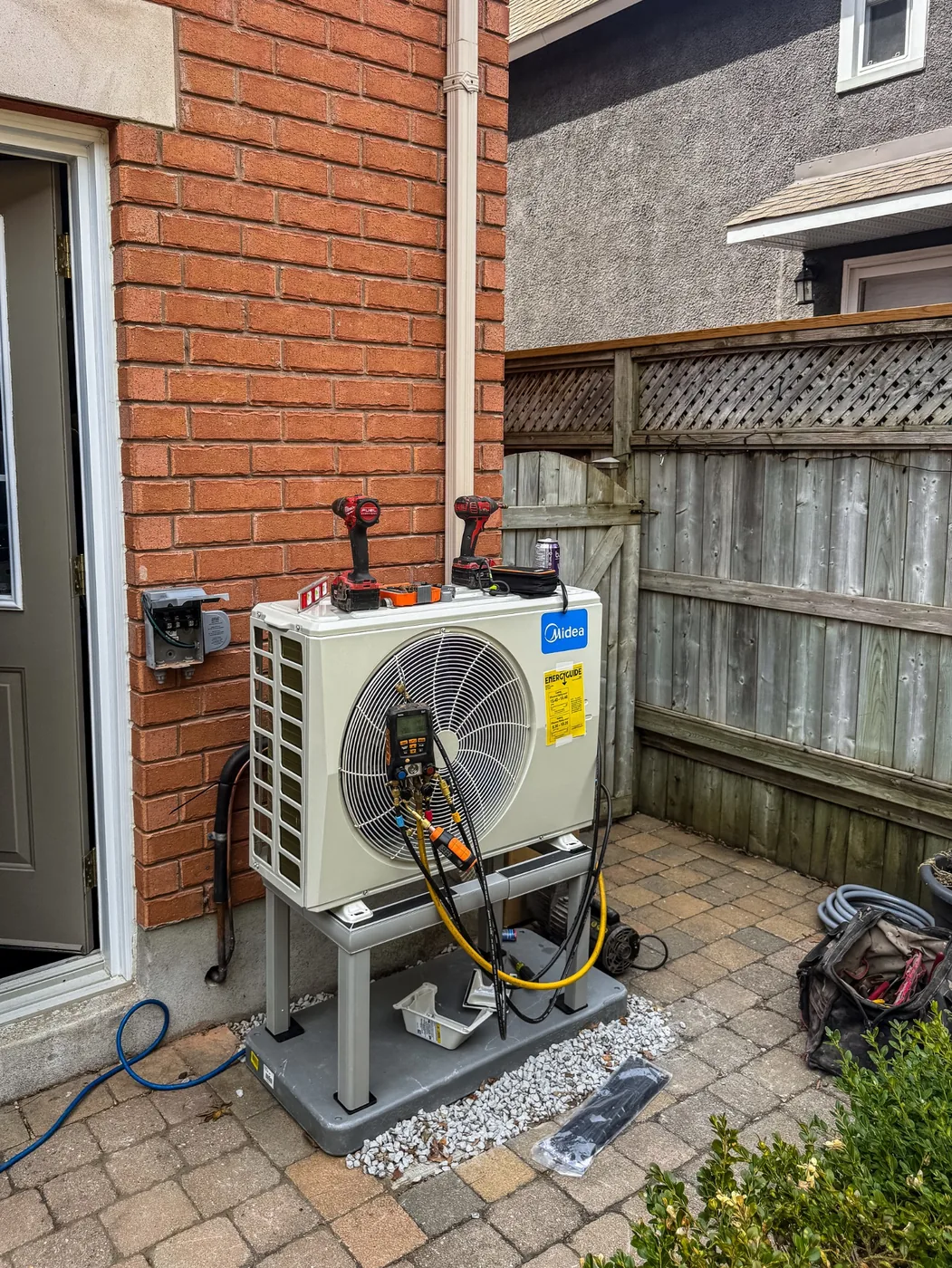 Midea heat pump being commissioned during an Ottawa-area installation