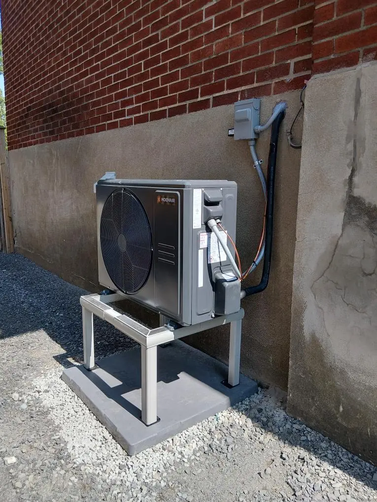 Central heat pump installed beside an Ottawa-area home