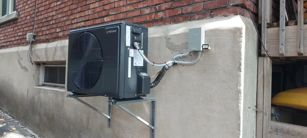 Moovair cold-climate heat pump installed on wall brackets at an Ottawa-area home