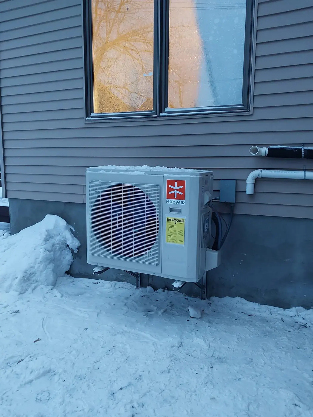 Moovair cold-climate heat pump installed beside an Ottawa home